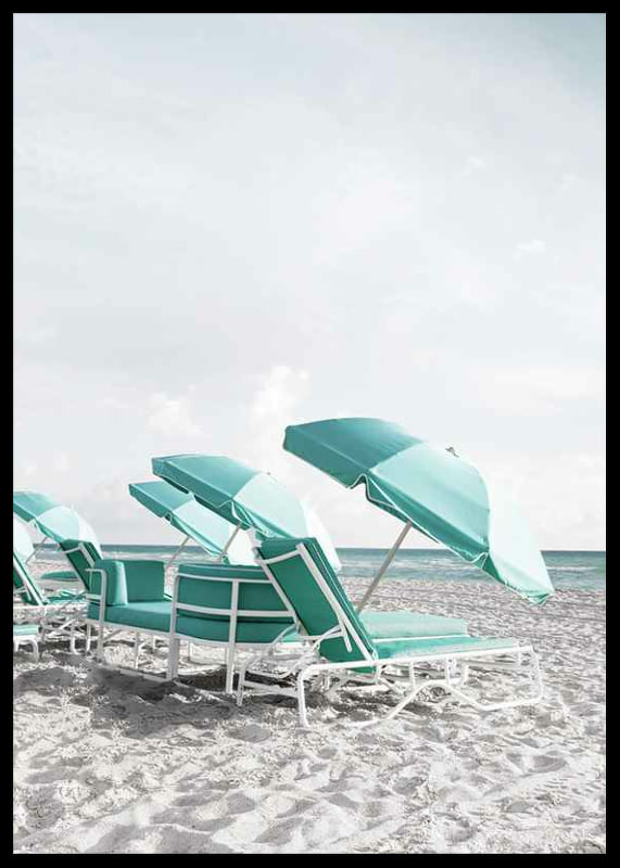 Photograph of turquoise umbrellas and sun loungers on beach-12
