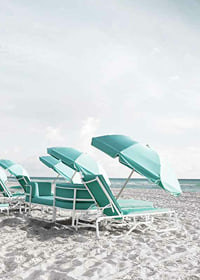 Photograph of turquoise umbrellas and sun loungers on beach-7