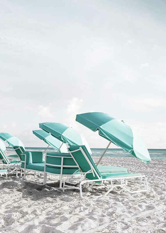 Photograph of turquoise umbrellas and sun loungers on beach-12