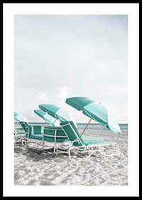 Photograph of turquoise umbrellas and sun loungers on beach-0