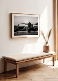 Black and white photography of couple in convertible at sunset over ocean-8