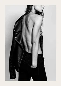 Black and white photo of young woman in jeans with leather jacket-3
