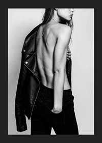 Black and white photo of young woman in jeans with leather jacket-5