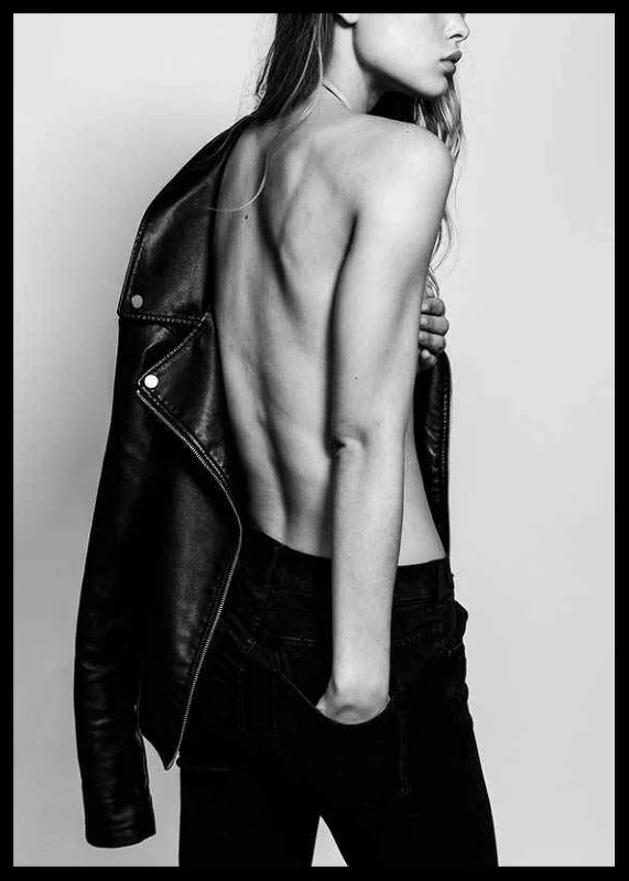 Black and white photo of young woman in jeans with leather jacket-12