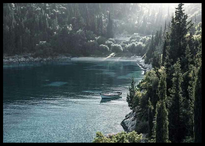 Photograph of lone boat on turquoise water at forested bay-12