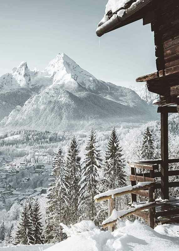 Snowy mountain cabin and alpine village with tall fir trees and mountains-12