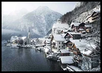 Photograph of Hallstatt by the lake, snow-covered houses and mountains-6