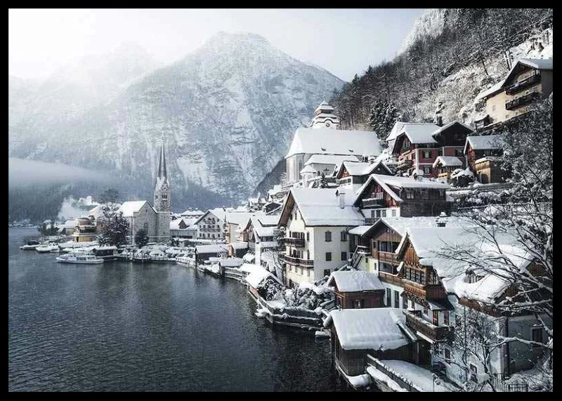 Photograph of Hallstatt by the lake, snow-covered houses and mountains-12