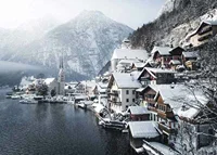 Photograph of Hallstatt by the lake, snow-covered houses and mountains-7