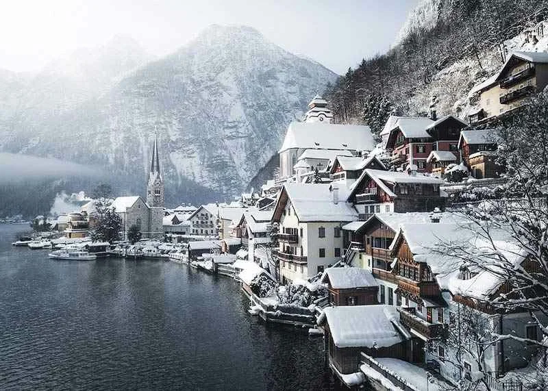 Photograph of Hallstatt by the lake, snow-covered houses and mountains-12
