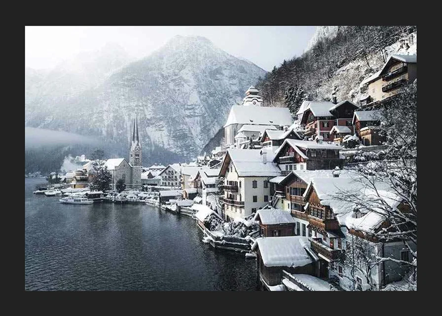 Photograph of Hallstatt by the lake, snow-covered houses and mountains-12