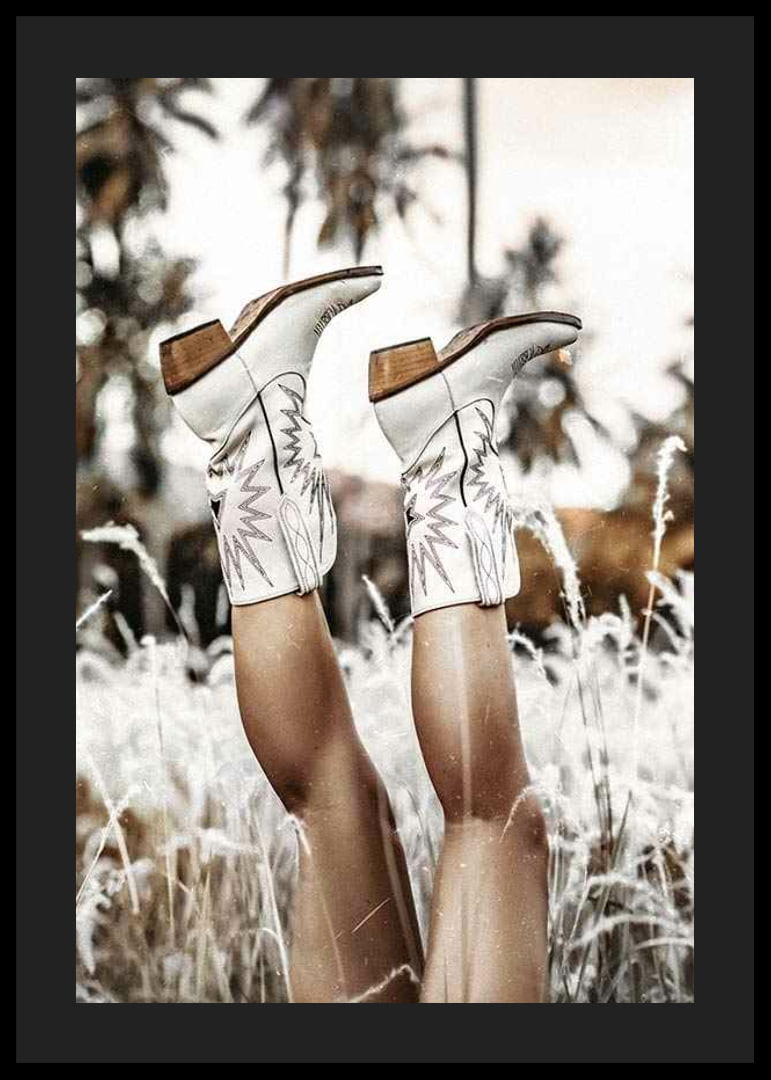 Photograph of legs with white cowboy boots in grass field-12
