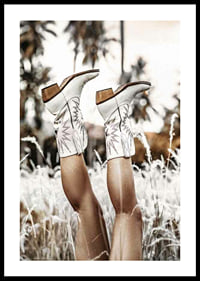 Photograph of legs with white cowboy boots in grass field-0