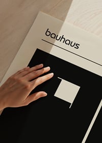 Graphic Bauhaus-inspired design with black shapes on a beige background-3