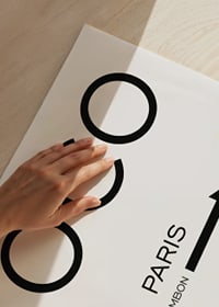 Minimalist black text COCO Paris 31 Rue Cambon arrow-3