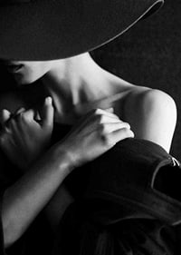 Black and white fashion photography of woman with hat in profile-7
