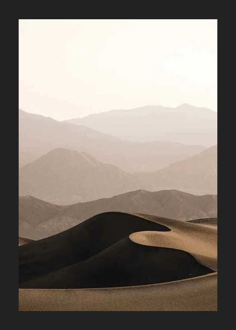 Soft-toned desert landscape with rolling dunes and mountains-12