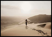 Photographic woman in hat on sand dunes in hot desert environment-6