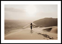 Photographic woman in hat on sand dunes in hot desert environment-0