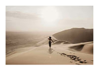 Photographic woman in hat on sand dunes in hot desert environment-1