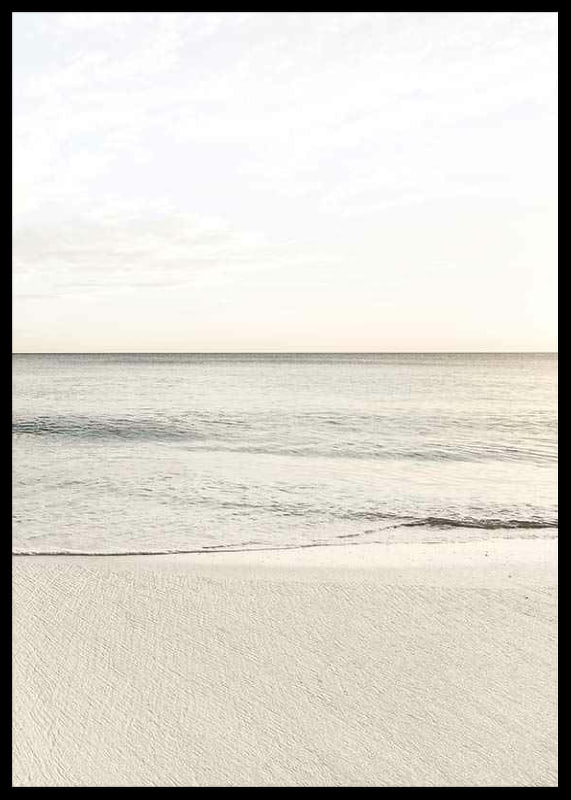 Photograph of calm sea at the beach in light beige tones-12