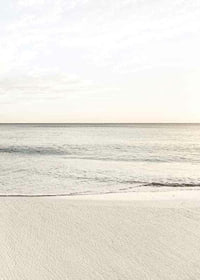 Photograph of calm sea at the beach in light beige tones-7