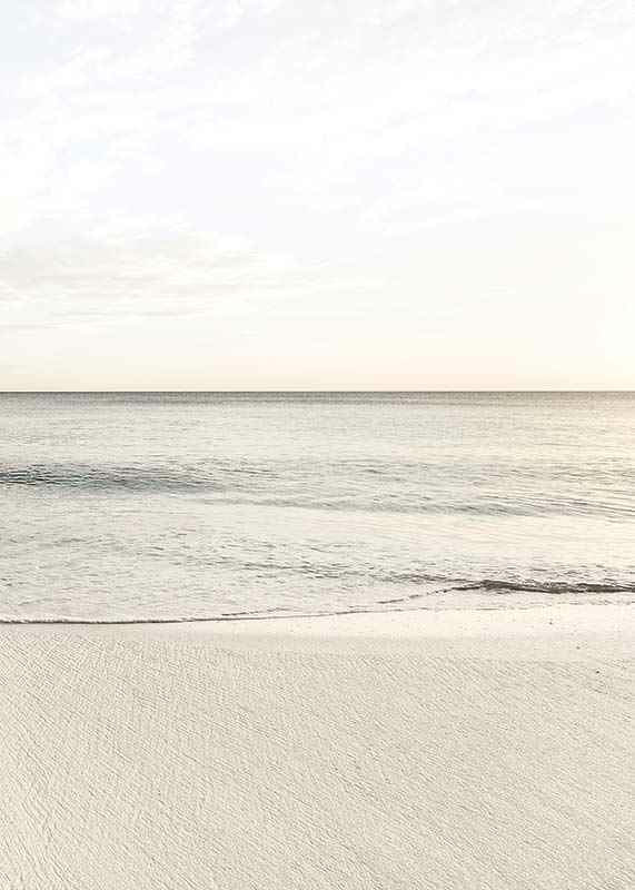 Photograph of calm sea at the beach in light beige tones-12