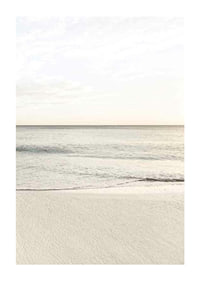 Photograph of calm sea at the beach in light beige tones-1
