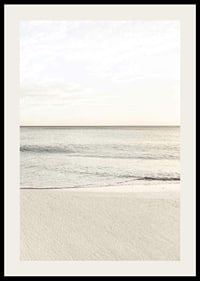 Photograph of calm sea at the beach in light beige tones-2