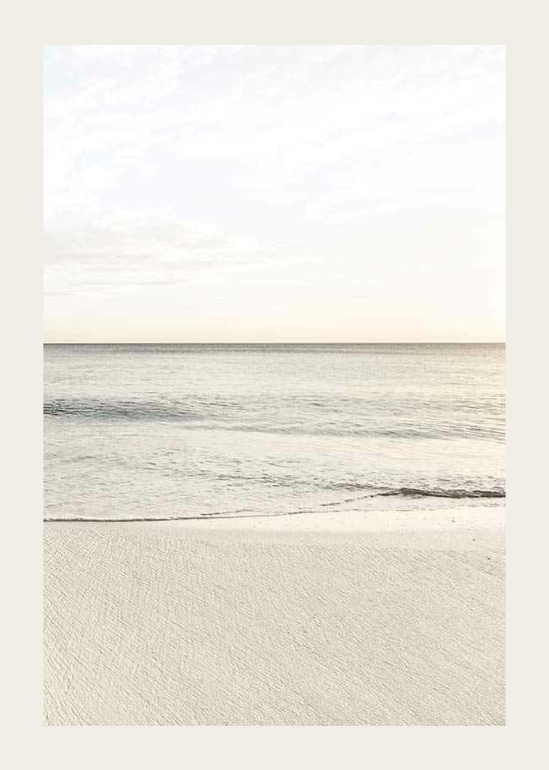 Photograph of calm sea at the beach in light beige tones-12