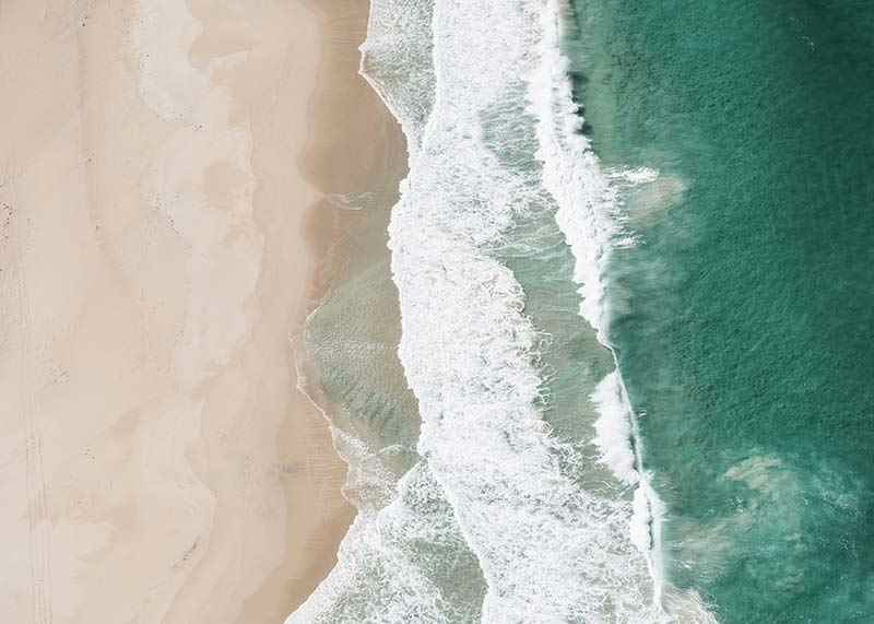 Aerial view of sandy beach with turquoise sea and white waves-12