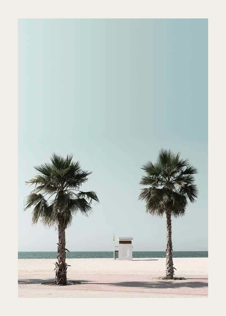 Photographic view of two palm trees and lifeguard tower at beach-12