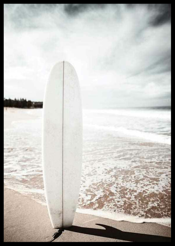 Photographic surfboard standing in the sand at the ocean's edge-12