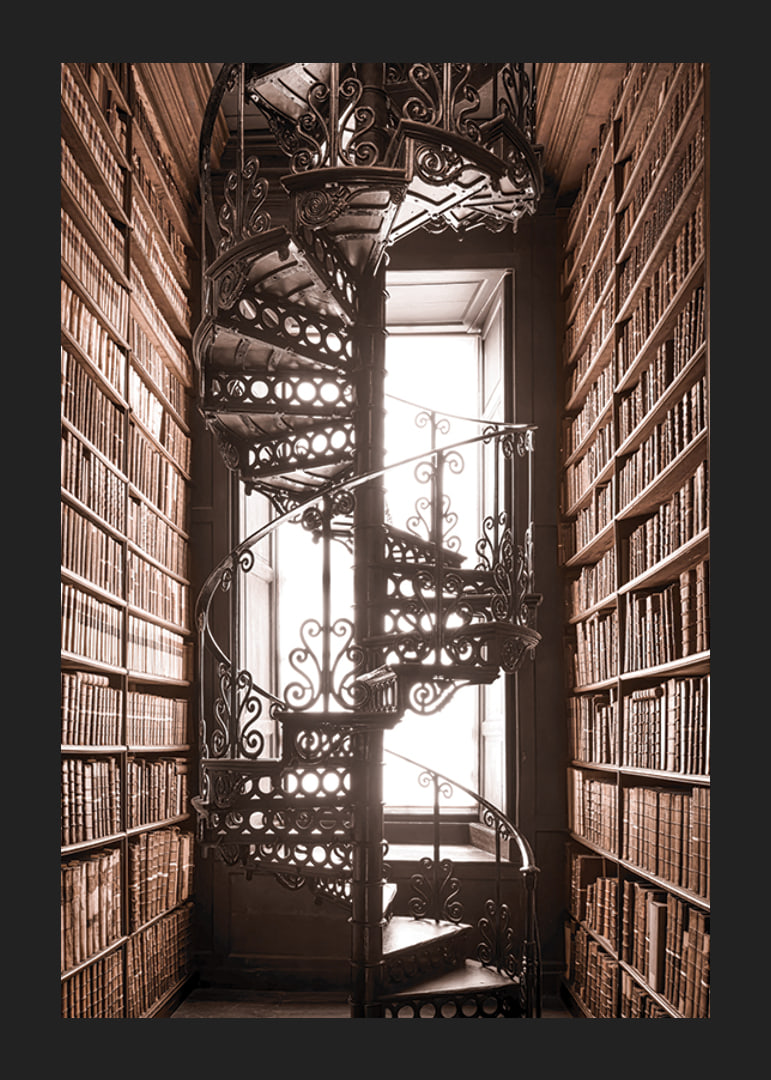 Photograph of spiral staircase in historic library with books-12