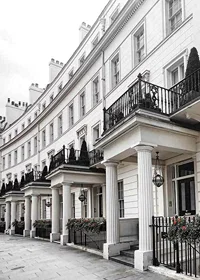 Photograph of white Georgian townhouses with wrought iron details-7
