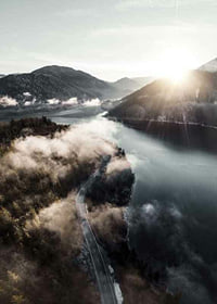 Photographic landscape with lake, mountains and fog in morning light-7