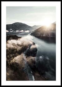Photographic landscape with lake, mountains and fog in morning light-0