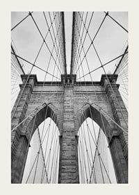 Black and white close-up of Brooklyn Bridge with cables and arches-3