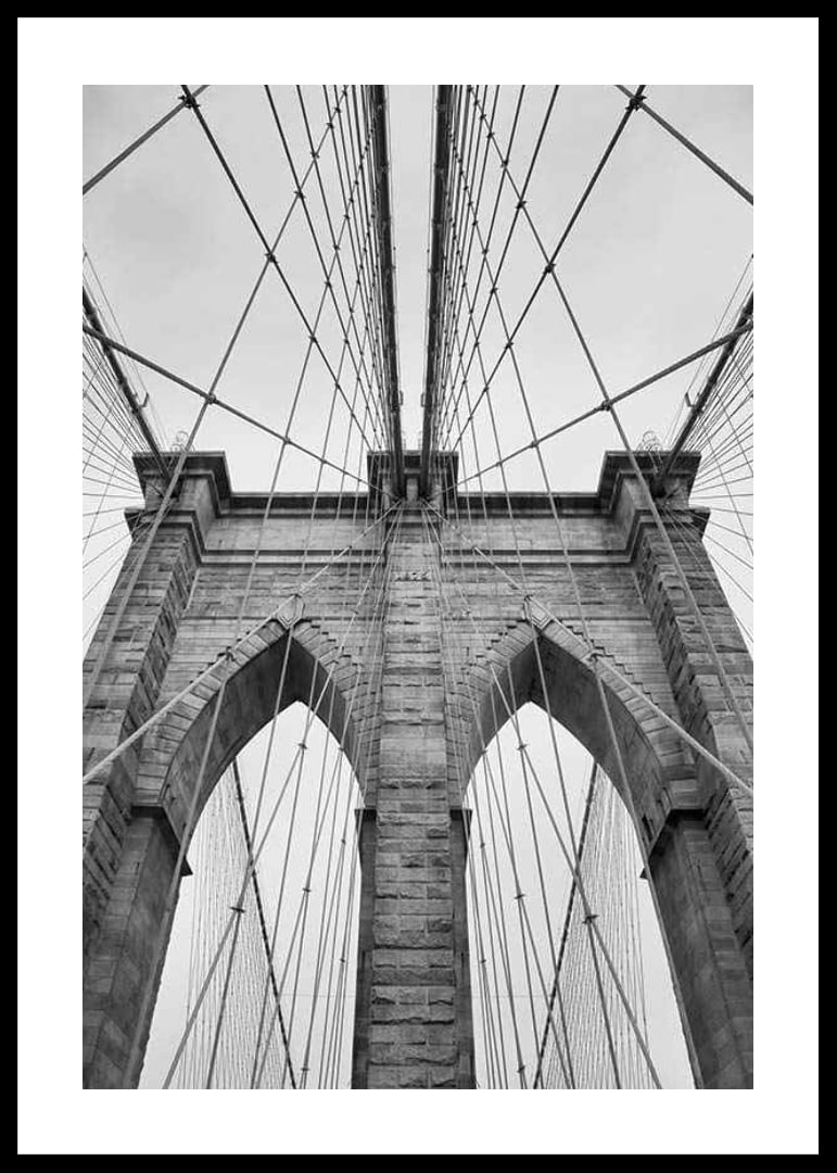 Black and white close-up of Brooklyn Bridge with cables and arches-12