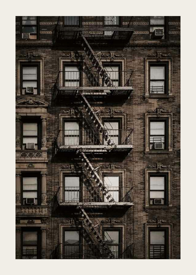 Photographic view of brick building with fire escape in New York-12