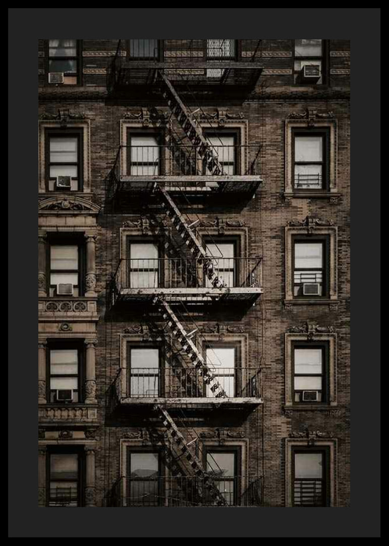 Photographic view of brick building with fire escape in New York-12