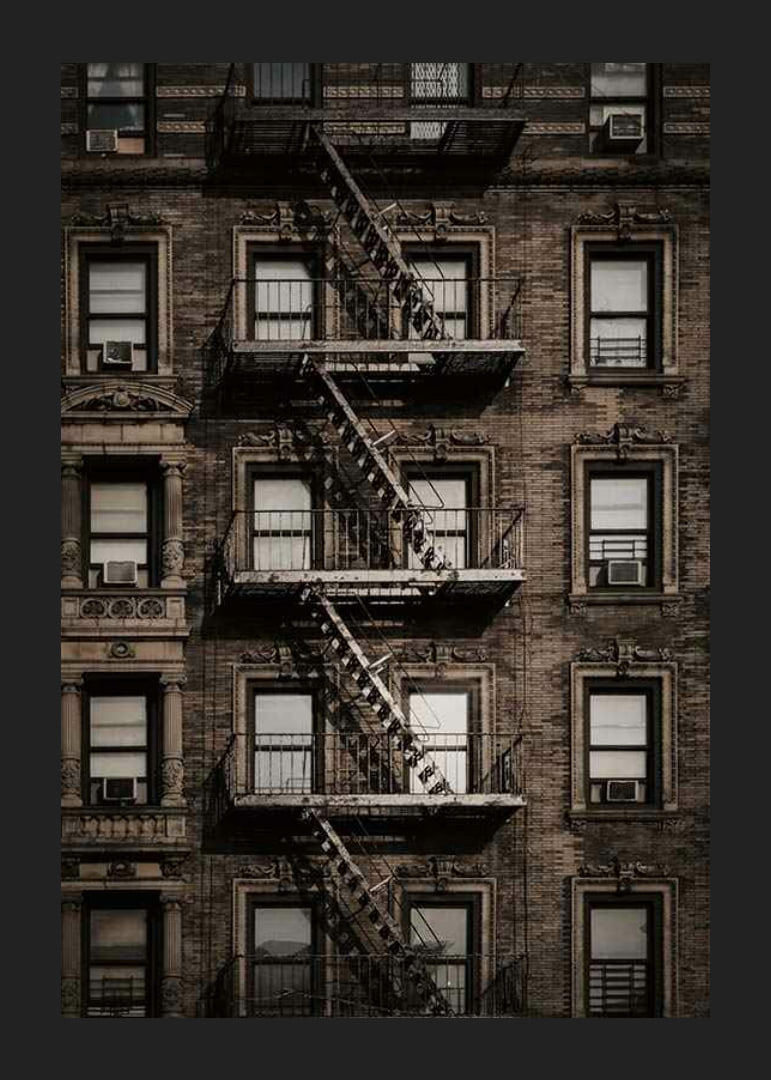 Photographic view of brick building with fire escape in New York-12