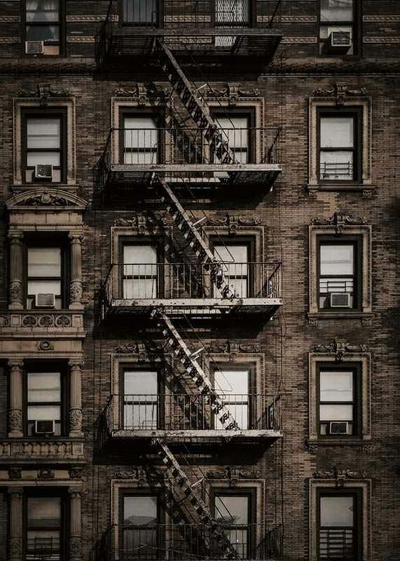 Photographic view of brick building with fire escape in New York-12