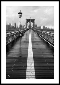 Black and white photograph of Brooklyn Bridge with wet wooden surface-0