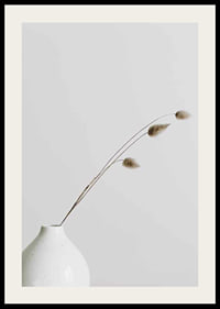 Photograph of dried blades of grass in white vase against light background-2