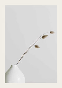 Photograph of dried blades of grass in white vase against light background-3