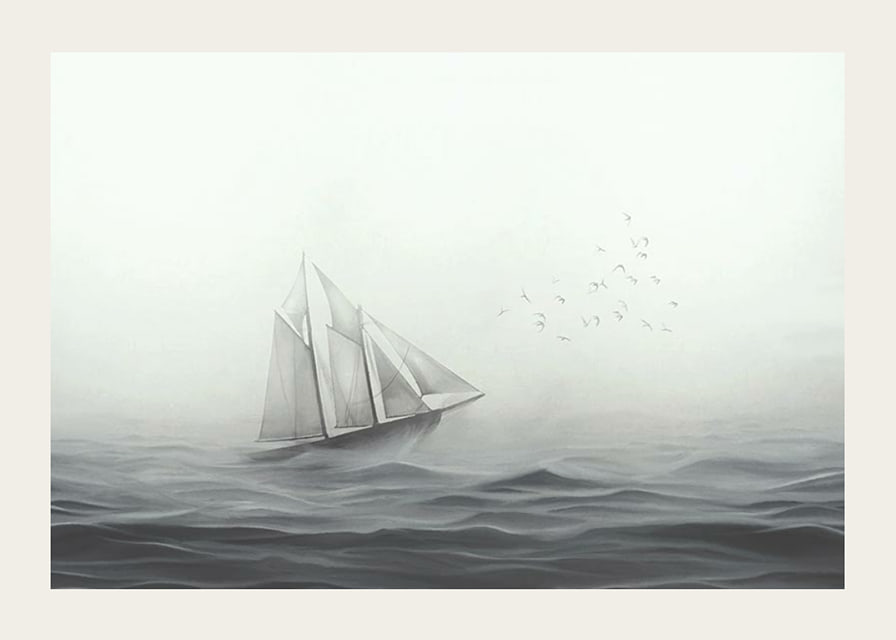 Sailboat with big white sails on foggy sea in grayscale-12