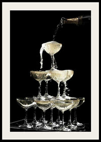 Photograph of champagne tower with flowing bubbles against black background-4