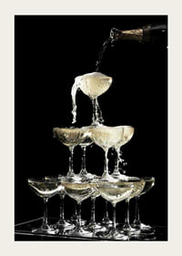 Photograph of champagne tower with flowing bubbles against black background-5