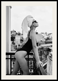 Black and white photograph of woman in swimsuit on balcony-2